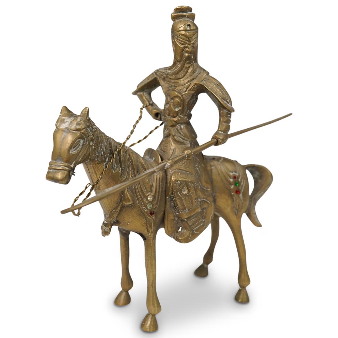 Vintage Chinese Brass Warrior: DESCRIPTION: A vintage Chinese brass warrior holding his weapon sitting on top of his horse finished with synthetic diamonds rubies and emeralds. marked China on the side of the horse. CIRCA: 1920 - 1