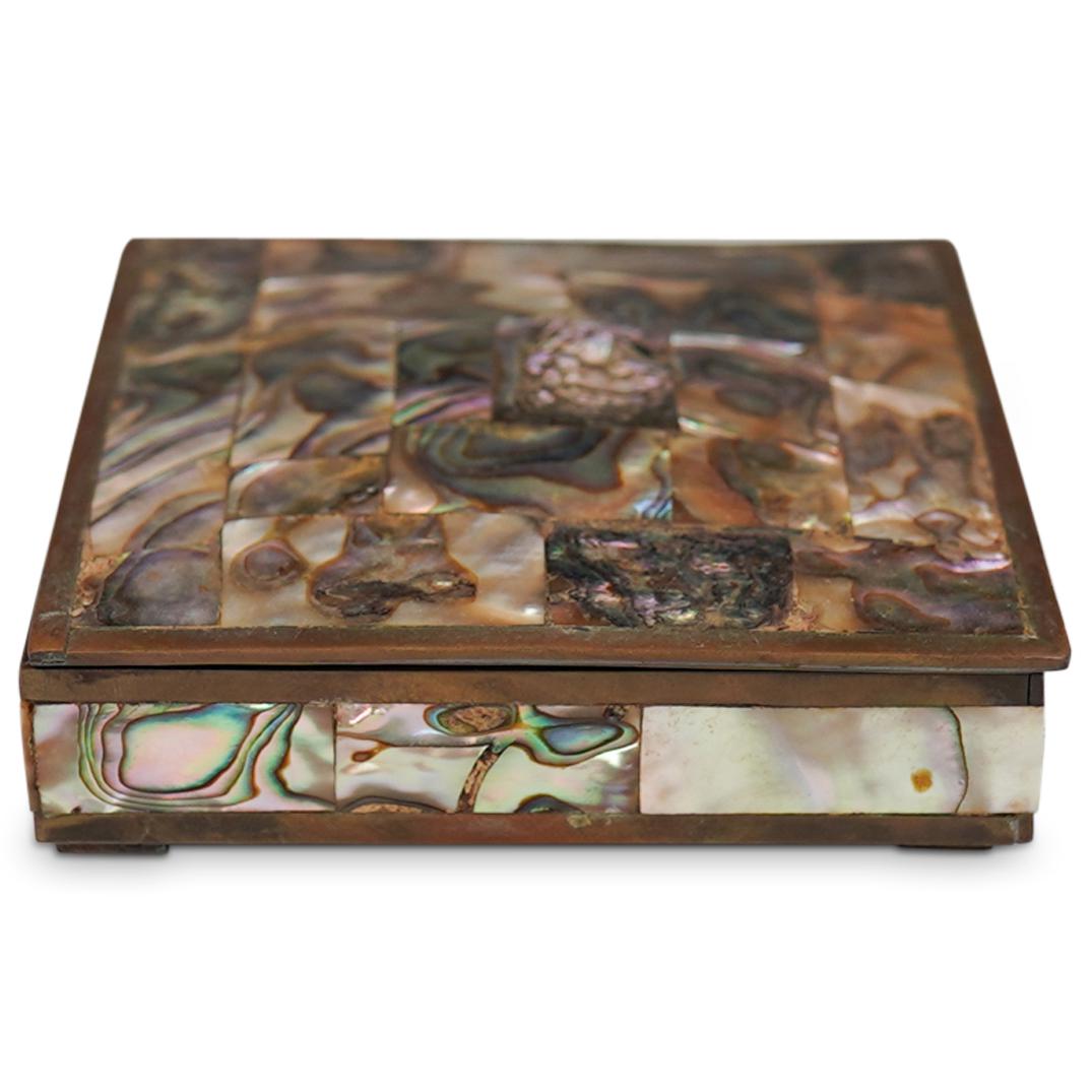 Vintage Mexican Mother of Pearl and Brass Box: DESCRIPTION: A Mexican box composed of a brass foundation, decorated with tessellated Mother of Pearl along the exterior, stamped along the underside "Hecho In Mexico" CIRCA: Late 20th Cent. ORIGIN: M