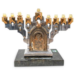 Frank Meisler "Golden Gate" Menorah: DESCRIPTION: Frank Meisler Judaica "Golden Gate" Hanukkah Menorah. Frank Meisler limited edition sculpture on a marble base. Features a Menorah in silver and gilded tones with Hebrew scripture.