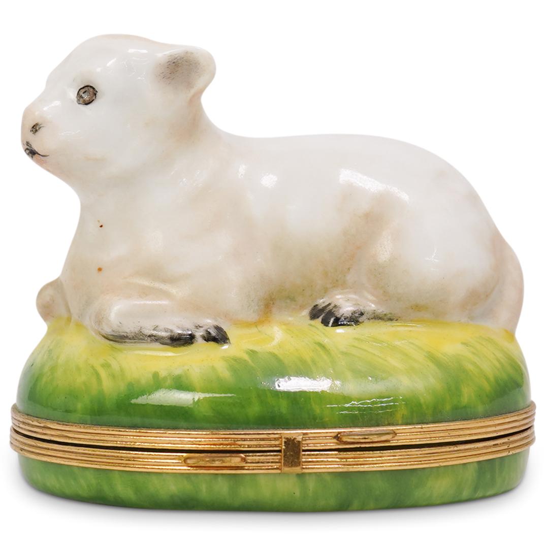 Limoges Porcelain Lamb Pill Box: DESCRIPTION: Limoges porcelain pill box adorning a rested lamb on the lid. Marked "Limoges" inside the pill box. CIRCA: 20th Century ORIGIN: France DIMENSIONS: H 3.0" x W 3.0" CONDITION: Great conditi