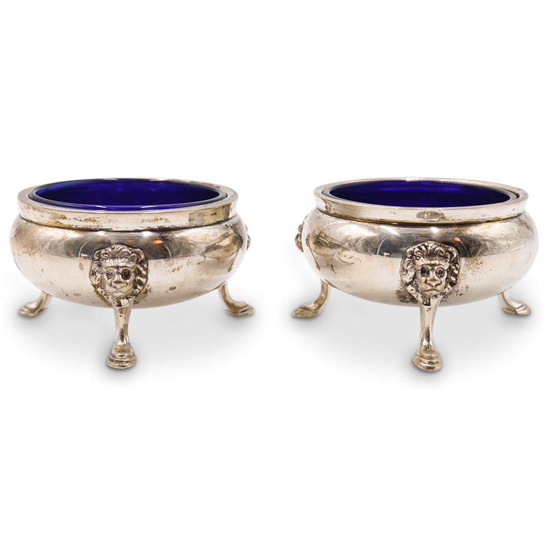 Pair of Sterling Silver and Cobalt Blue Glass Cellars: DESCRIPTION: Pair of sterling silver salt and pepper cellars with cobalt blue glass interior. Marked "Sterling" underneath. Total Weight without glass: 136g CIRCA: 20th Century ORIGIN: European DIMENS