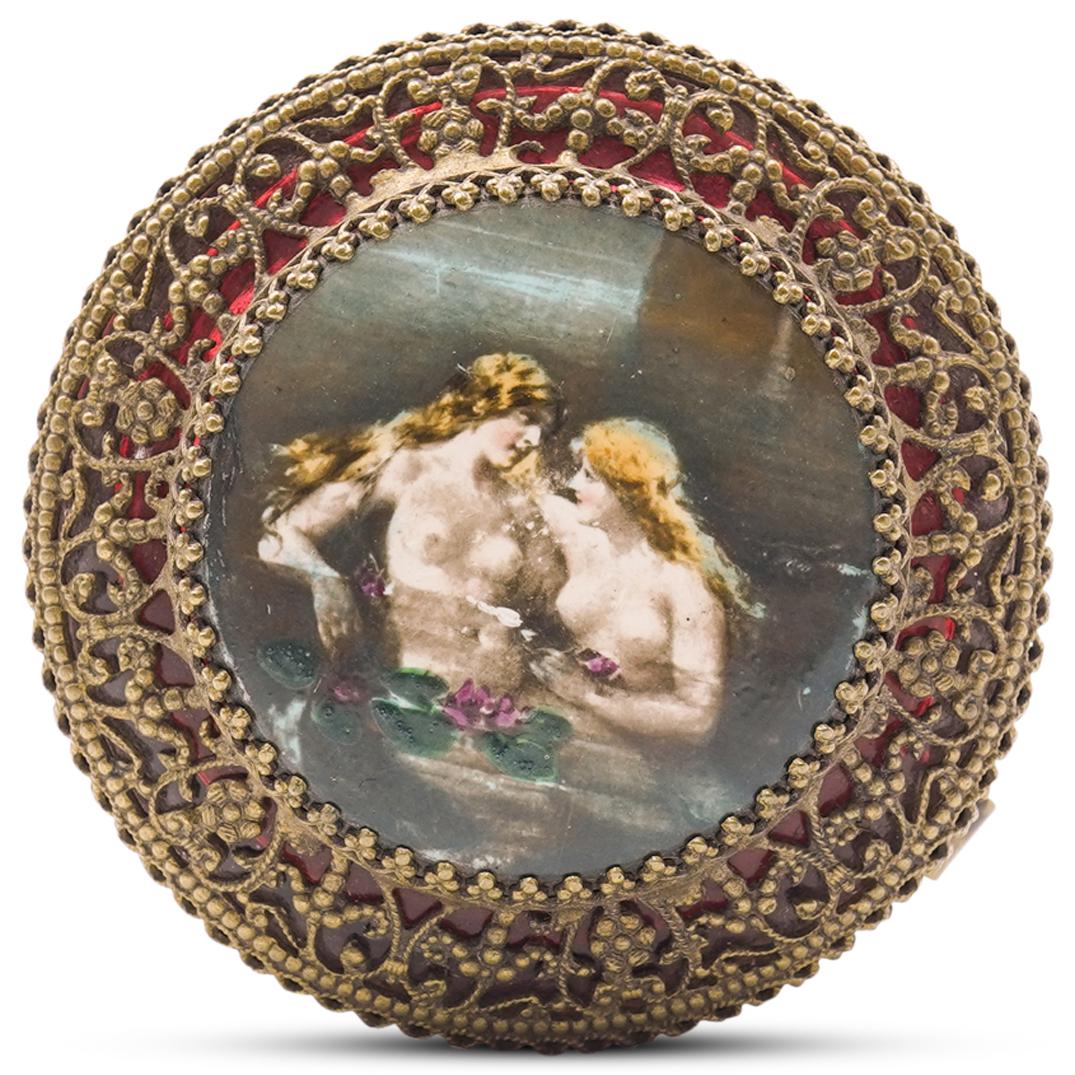 Gilded Silver Filigree Trinket Box: DESCRIPTION: Gilded silver filigree trinket box featuring an ornate motif and an erotic center portrait. CIRCA: 20th Century ORIGIN: France DIMENSIONS: H 1.5" x W 2.0" CONDITION: Great condition. See 