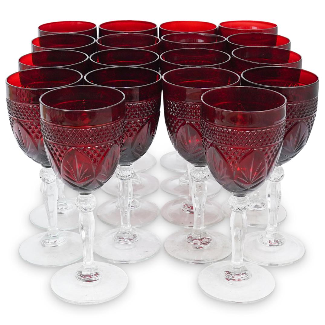(19 Pc) Ruby Red Wine Glasses: DESCRIPTION: (19 Pc) A set of (19) ruby red wine glasses with clear crystal stems and diamond pattern designed bodys. CIRCA: 20th Cent. ORIGIN: Czech Republic DIMENSIONS: H: 8" x D: 3" CONDITION: Grea