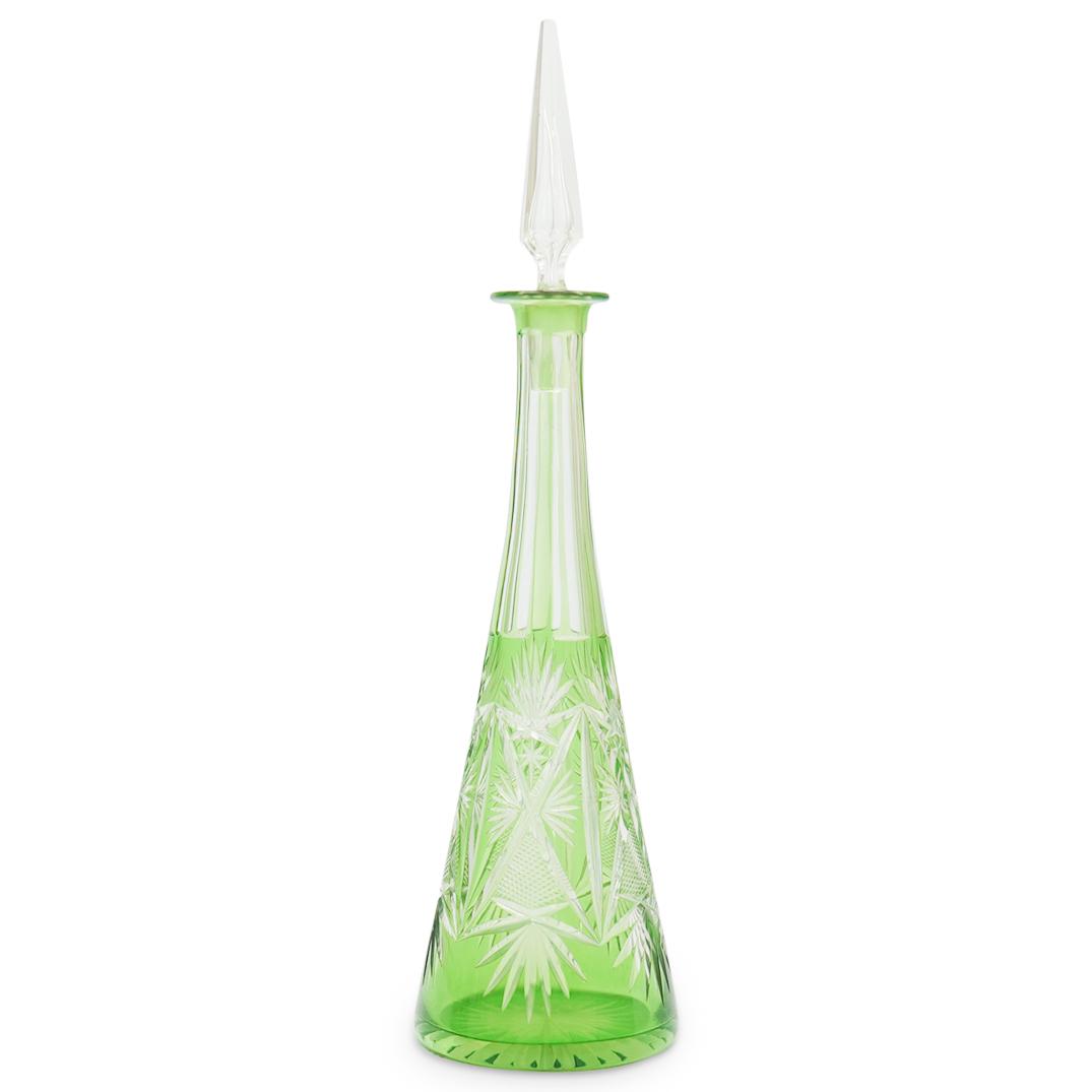 Bohemian Green Crystal Decanter: DESCRIPTION: A Bohemian green crystal cut decanter with clear pointed stopper design. CIRCA: 20th Cent. ORIGIN: Czech Republic DIMENSIONS: H: 17.5" x D: 4.5" CONDITION: Great condition. See lot descri