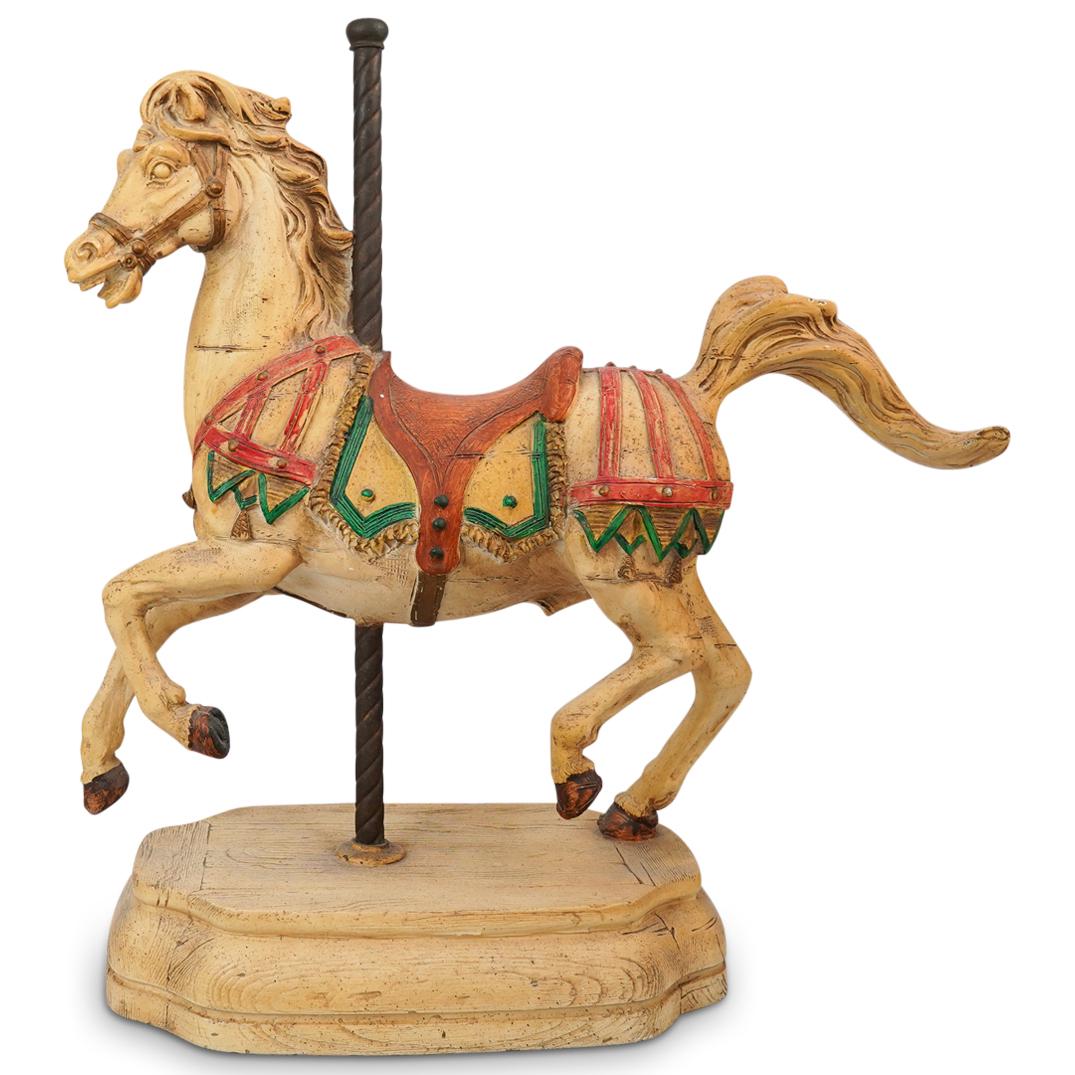 Carousel Horse Statue: DESCRIPTION: A carousel horse statue with intricately designed saddle and tack accents. Further designed with a twisted metal pole and tiered base, engraved makers mark above front leg. CIRCA: 20th Ce