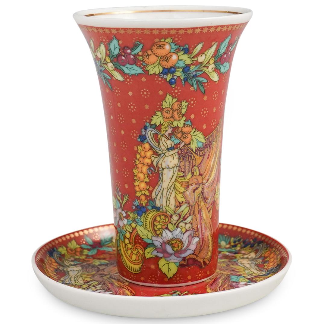 Versace "Le Reve de Noel" Tea Cup and Saucer: DESCRIPTION: Versace "Le Reve de Noel" porcelain tea cup and saucer. Marked "Versace Rosenthal, Germany, Le Reve de Noel" underneath. CIRCA: 20th Cent. ORIGIN: Germany DIMENSIONS: (Cup) H: 4" x D: 2.5