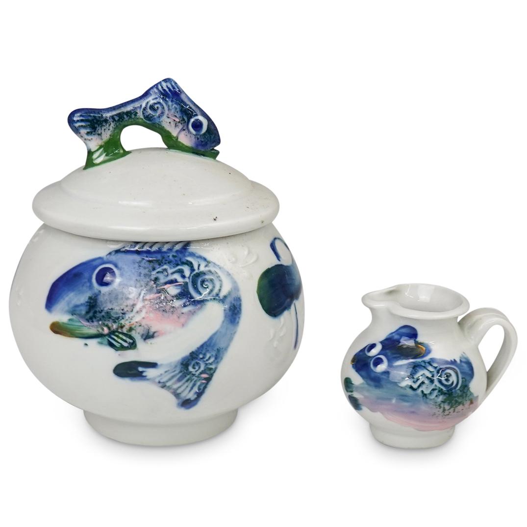 Misc lot of Italian Porcelain: DESCRIPTION: Misc lot of Italian Porcelain features fish motif hand painted design. Composed of a lidded urn and a creamer. Illegibly signed. CIRCA: 20th Ct ORIGIN:Italy DIMENSIONS:Urn: H:8 W:7", Crea