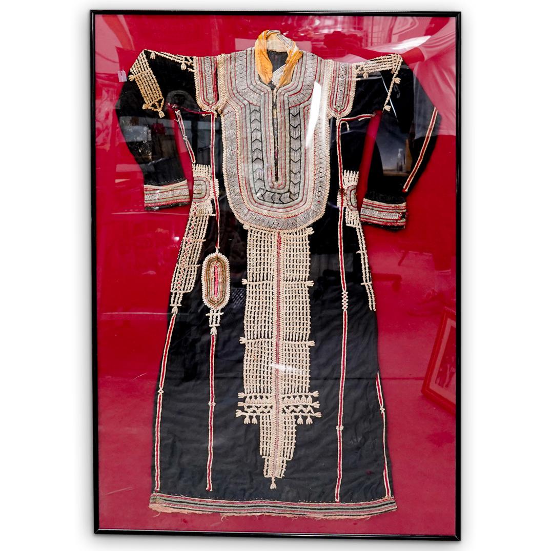 Antique Turkish Wedding Garb: DESCRIPTION: An antique Turkish wedding garb with hand embroidered bead and metallic stitched designs. Mounted in a black metal frame. CIRCA: 18th - 19th Cent. ORIGIN: Turkey DIMENSIONS: H: 51.5" x L: