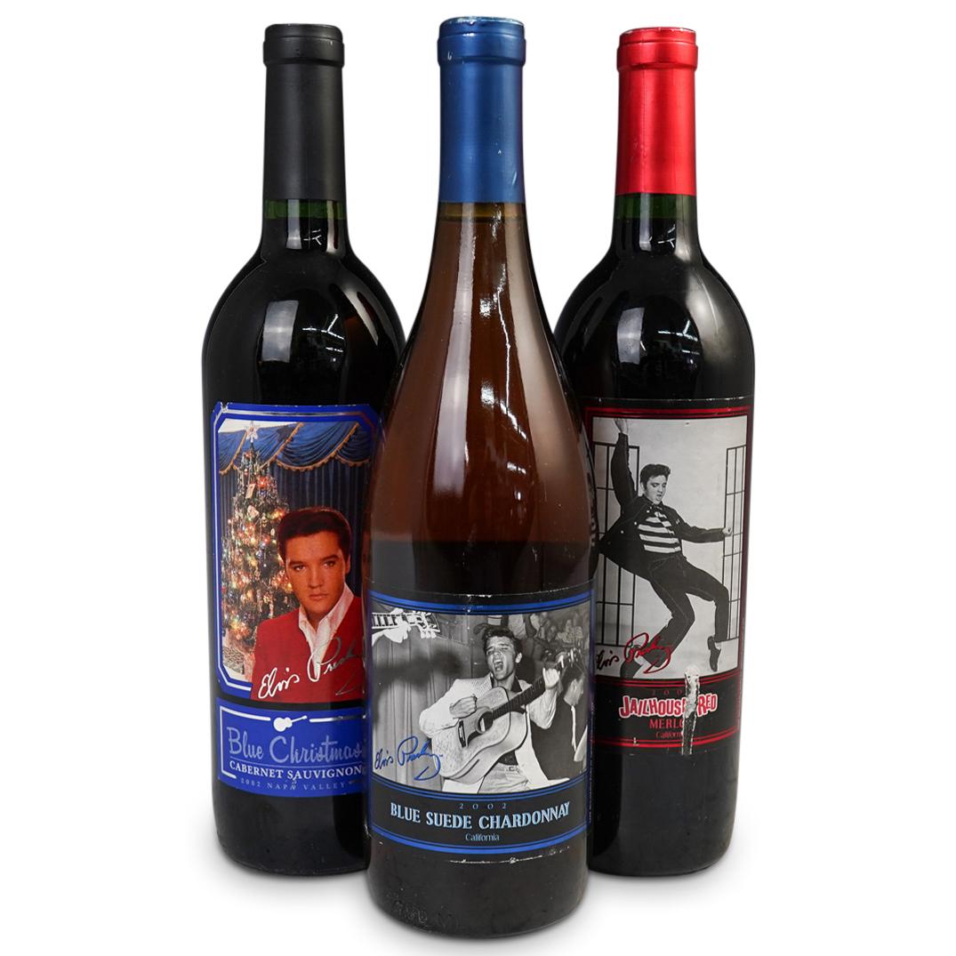 (3 Pc) Elvis Presley Wine Lot: DESCRIPTION: (3 Pc) Elvis Presley wine collection composed of (3) Chardonnay, Cabernet, and Merlot, (2002) CIRCA: 2002 ORIGIN: USA DIMENSIONS: H: 12" x D: 3" CONDITION: Great condition. See lot descri