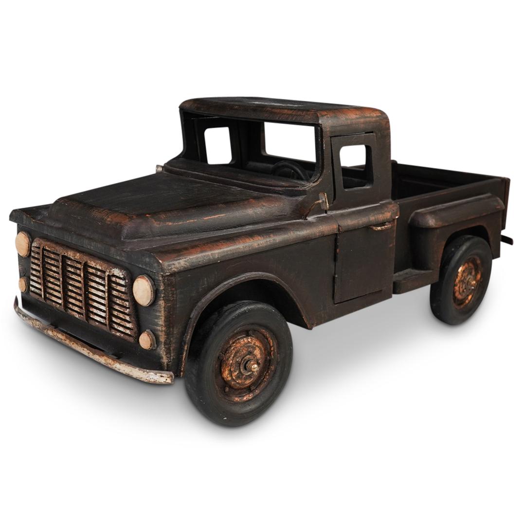 Decorative Wood Ford Truck: DESCRIPTION: A decorative Ford model truck composed of painted wood with a metal accents. CIRCA: 20th Cent. ORIGIN: USA DIMENSIONS: H: 11.5" x W: 10.5" x L: 25" CONDITION: Great condition. See lot des