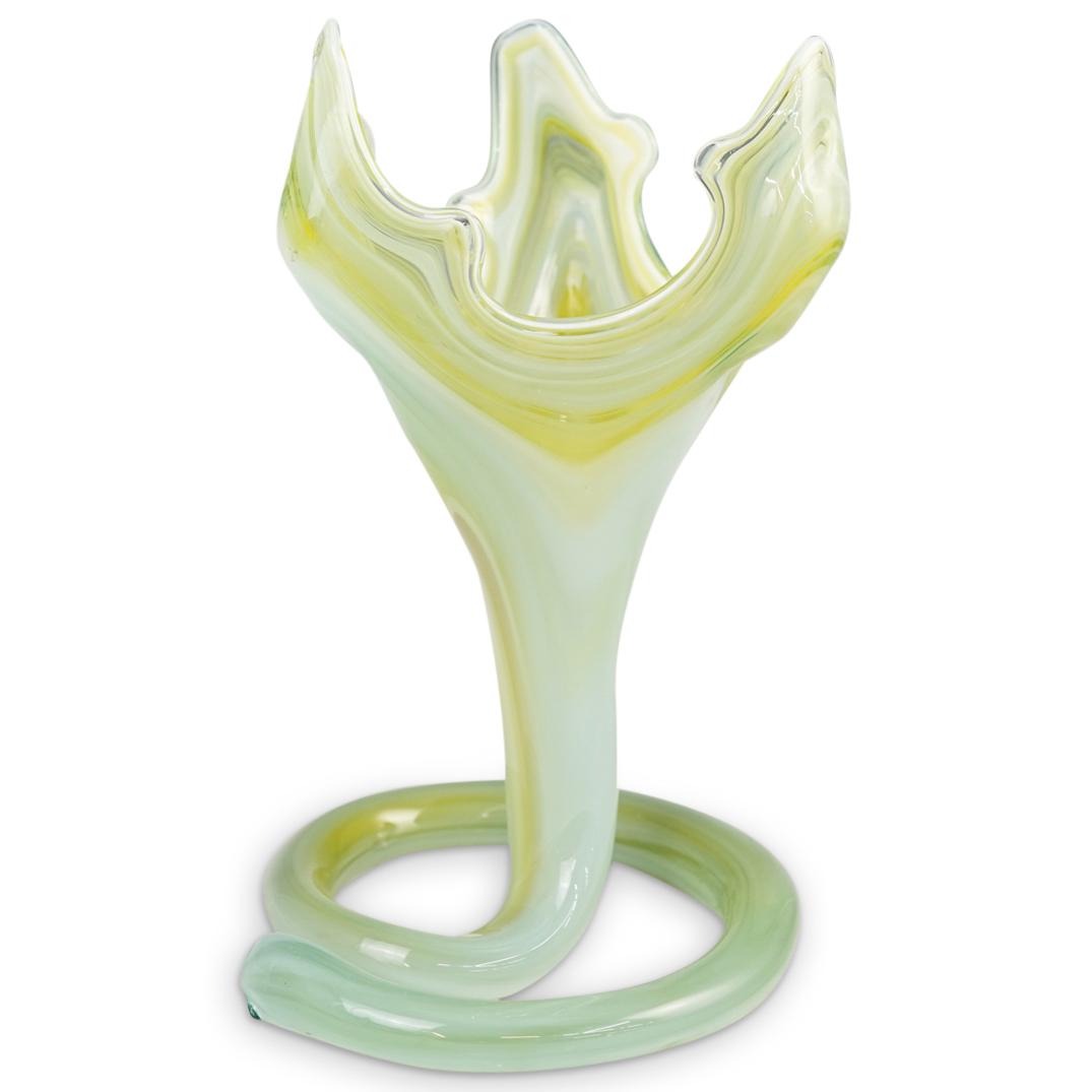 Murano Variegated Glass Vase: DESCRIPTION: A Murano Glass Vase.This is a hand blown stretch glass vase featuring a free-form with spiral base in variegated green and white color glass. Finished with three peaked lifts that create 