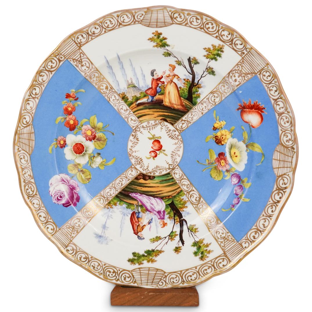 Meissen Porcelain Cabinet Plate: DESCRIPTION: A Meissen porcelain cabinet plate with figural courting scenes, floral decorations, and gilt accents. Marked with Meissen double crossed swords stamp.CIRCA: UnknownORIGIN: GermanyDIMENSIO