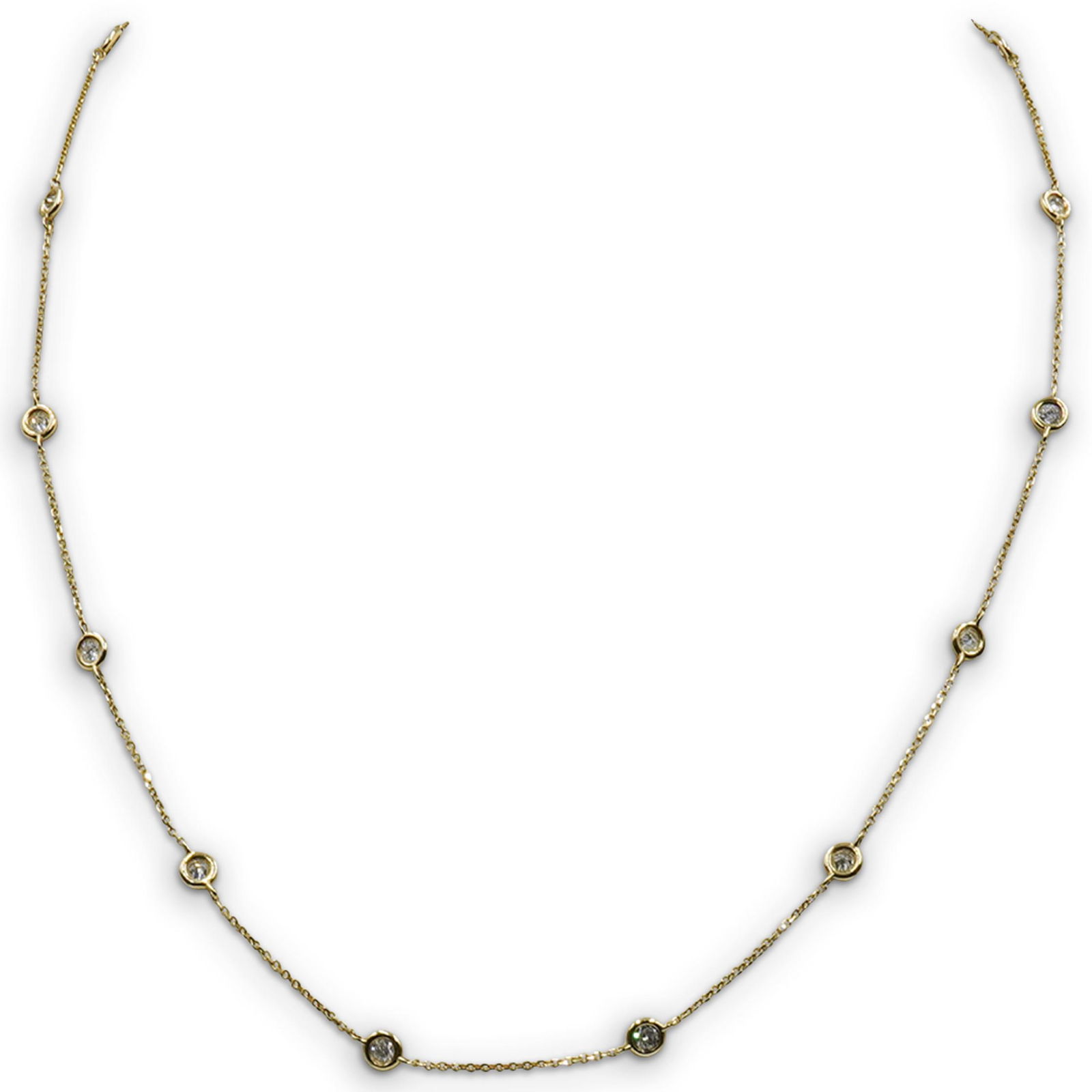 14k Gold "Diamonds By The Yard" Necklace: DESCRIPTION: A Diamonds by the yard necklace composed of 14k yellow gold, decorated with (13) .07 ct diamonds amounting to approx. .90 cts total. Stamped 14k, Total weight: 2.1 dwt CIRCA: 20th Cent. O