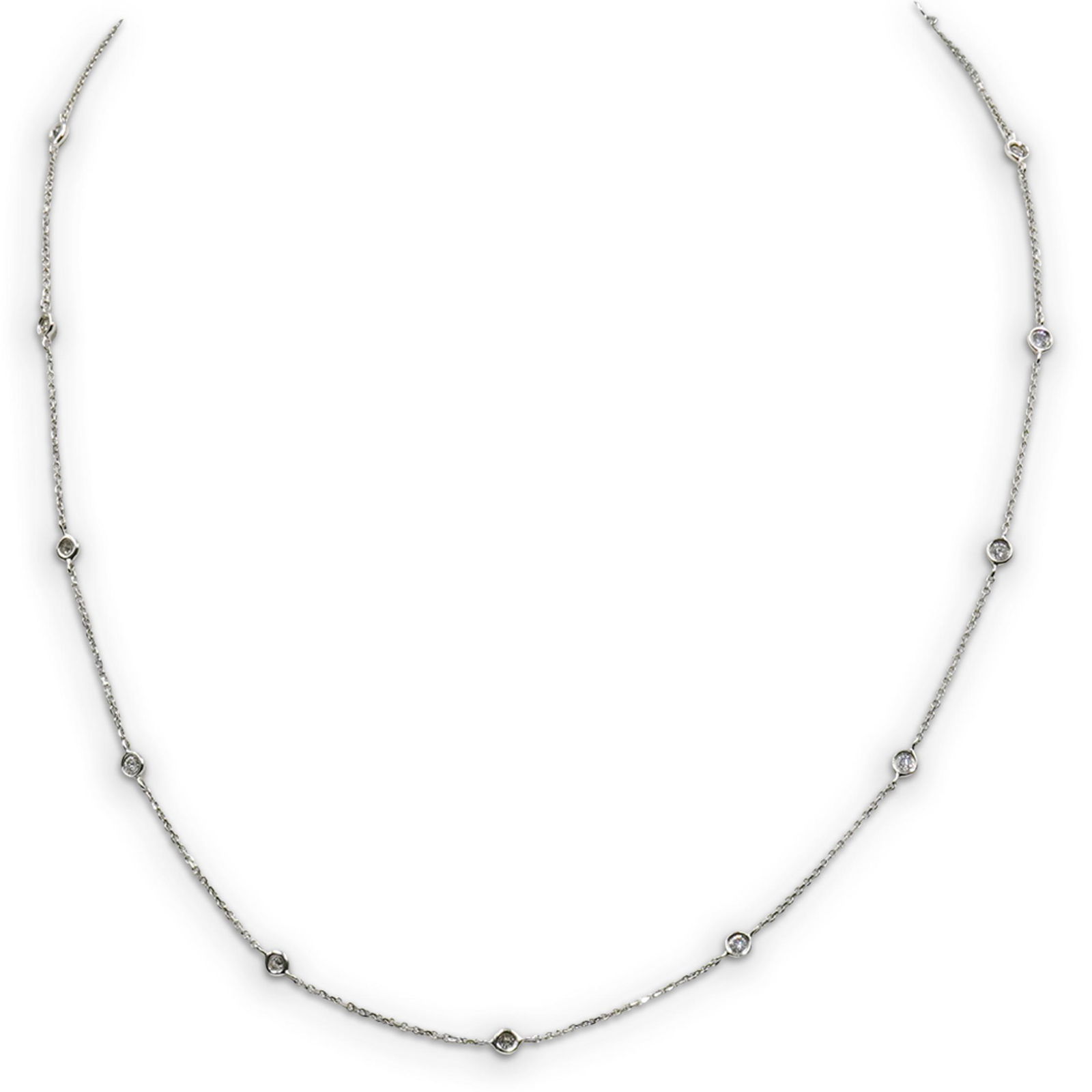 14k Gold "Diamonds By The Yard" Necklace: DESCRIPTION: A Diamonds by the yard necklace composed of 14k white gold, decorated with (13) .03ct diamonds. Stamped 14k, Total weight: 2.6 grams (1.7 dwt) CIRCA: 20th Cent. ORIGIN: USA DIMENSIONS: L: