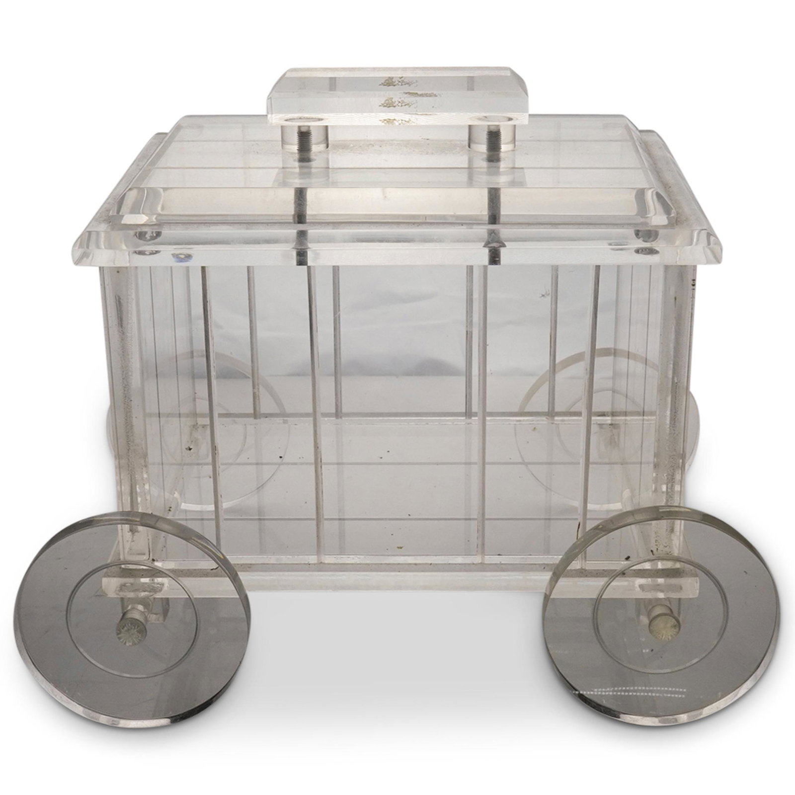 Designer Lucite Ice Bucket Cart: DESCRIPTION: Designer Clear Lucite Ice Bucket in the shape of a four wheeled lidded cart. CIRCA: 20th Century ORIGIN: USA DIMENSIONS: H: 9 1/2" W: 11 1/2" CONDITION: Great condition. See lot descripti