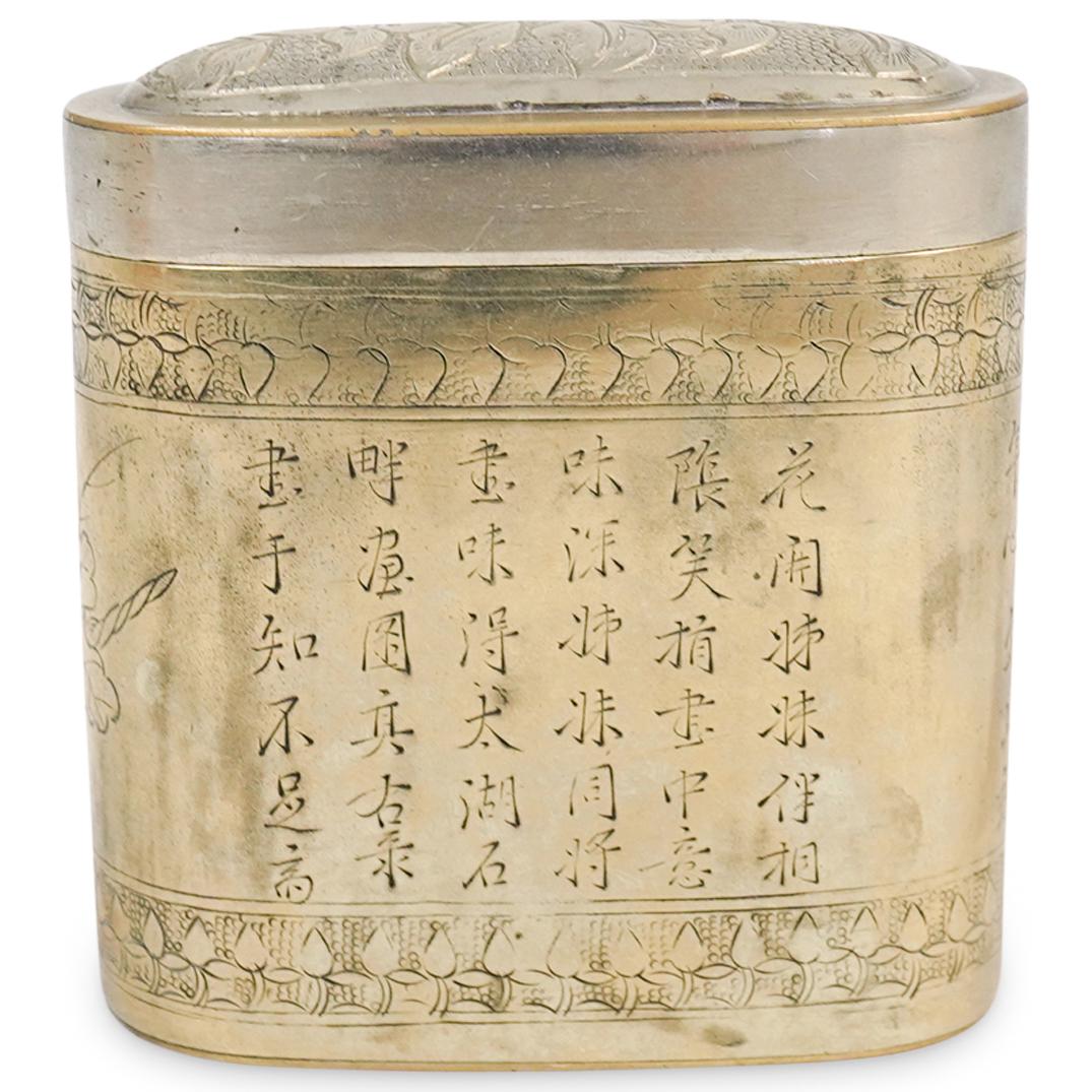 Chinese Baitong Paktong Engraved Opium Box: DESCRIPTION: A Chinese antique Baitong Paktong calligraphy engraved opium box, accented by etched floral patterns. Completed in brass and silver tones. Marked along the underside "China". CIRCA: 19th