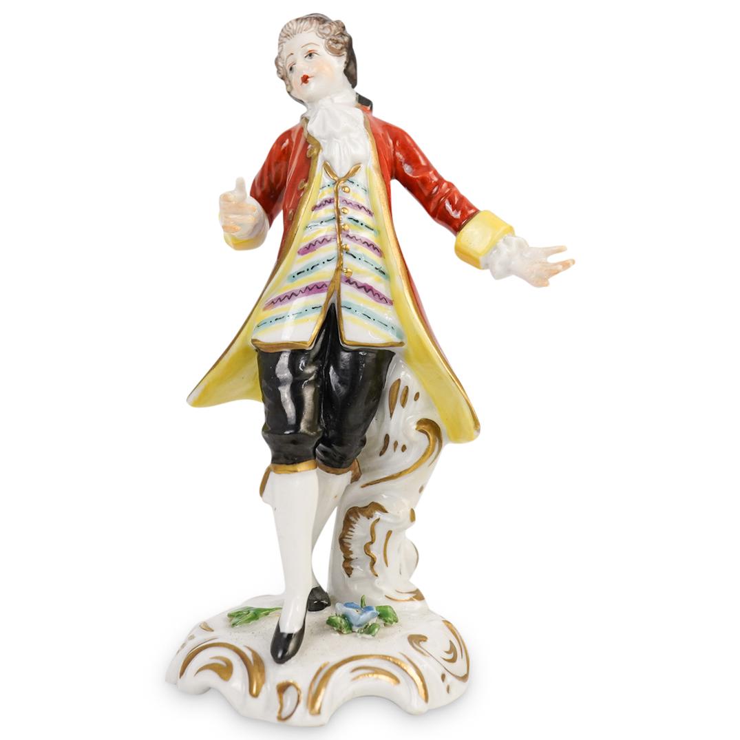 Sevres Porcelain Figurine: DESCRIPTION: A Sevres porcelain figurine depicts a man draped in Edwardian garb, stamped along the underside. CIRCA: 20th Cent. ORIGIN: France DIMENSIONS: H: 4.5" W: 2.75" CONDITION: has minor chip on