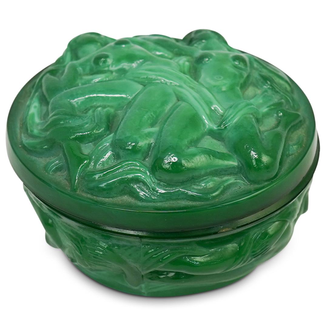 Erotic Malachite Glass Box: DESCRIPTION: A malachite glass lidded box with raised figural erotic designs. CIRCA: 20th Cent. ORIGIN: Unknown DIMENSIONS: H: 2.5" x D: 3.75" CONDITION: Great condition. See lot description for detai