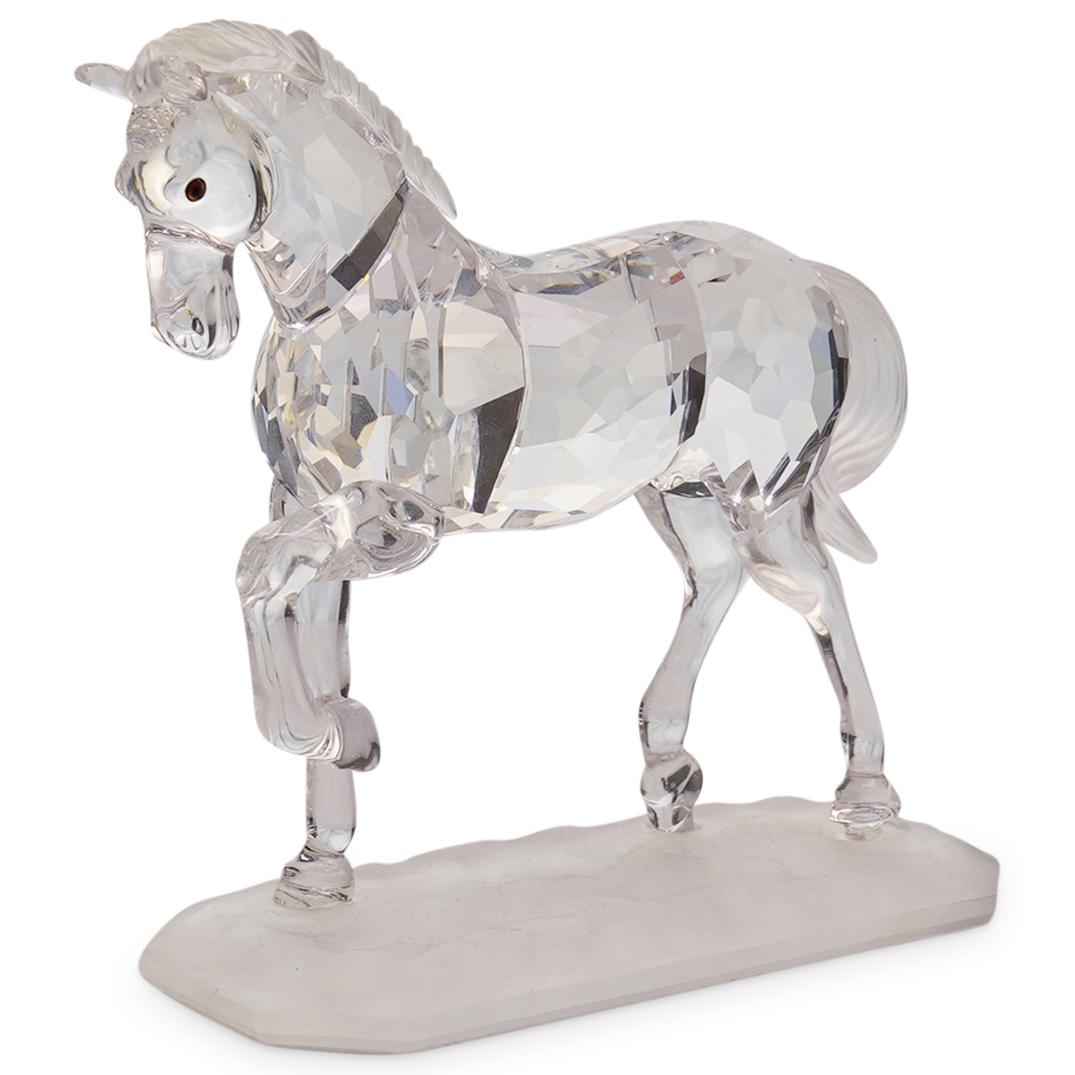 Swarovski " Arabian Horse " Crystal Figurine: DESCRIPTION: Swarovski Arabian Stallion Horse Crystal Figurine from the â€œHorses on Parade” collection. Swarovski code number 221609.This design was introduced in 1998 and retired in 2005. 