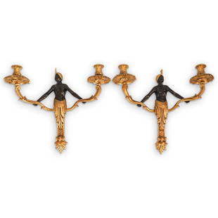 Pair of Gilt Bronze Blackamoor Sconces: DESCRIPTION: Pair of Bronze Blackamoor sconces features a figure at the center with two stemming arms decorated in gilt bronze and polychrome finishes. CIRCA: Early 20th Cent. ORIGIN: European