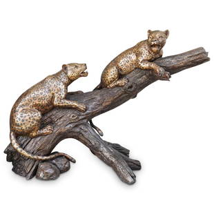 Signed Monumental Leopard Bronze Garden Statue: DESCRIPTION: A monumental bronze garden statue featuring the deception of two naturalistic cast leopards resting on a tree branch. Cast using the lost wax technique and signed lower right "Hill