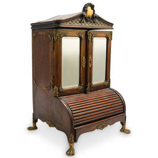 French Louis XV Miniature Secretary Inkwell: DESCRIPTION: French Louis XV Miniature Secretary Inkwell composed of wood decorated with ornate bronze accents. The front of the inkwell features beveled glass mirrors and a roll top shell, opens to