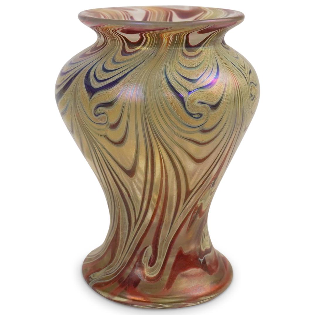 Iridescent Art Glass Vase: DESCRIPTION: Art Glass Vase with iridescent melt colorful pattern in iridescent green purple and burgundy accents. Signed Ron Colby 1980. D C 8CIRCA: 1980ORIGIN: ItalyDIMENSIONS: H: 5 1/2" W: 4 1/4" C