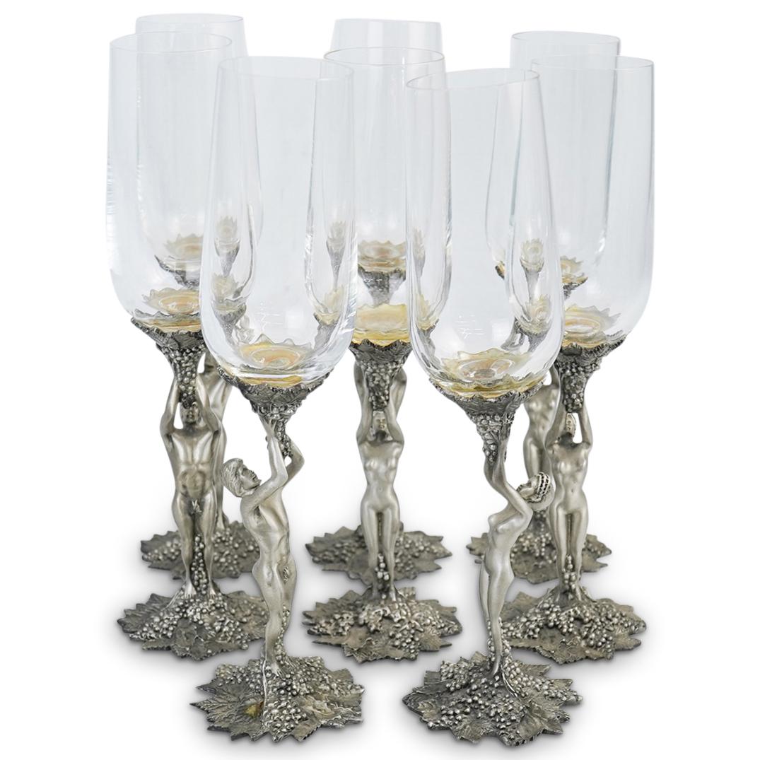(8Pc) Baker Art Foundry Figural Glasses: DESCRIPTION: (8pc) A set of Baker Art Foundry wine glasses. Features nude figural pewter stems supportings clear crystal champagne flutes. Marked "MFG. by Baker Art Foundry, Oakland CA. 1985 Carmel St