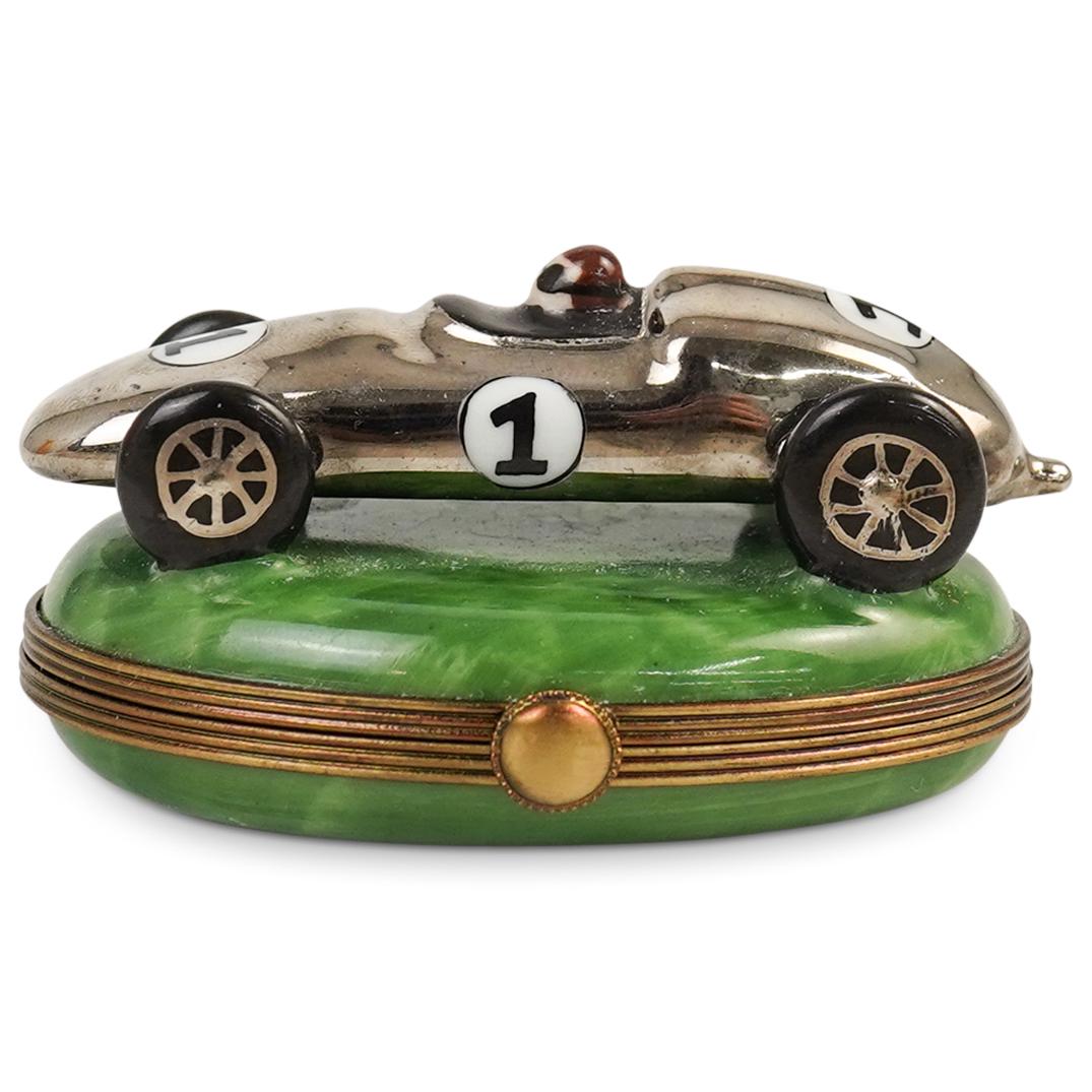 Limoges La Gloriette "Racing Car" Trinket Box: DESCRIPTION: A La Gloriette Limoges porcelain trinket box. Features a numbered one racing car. Hand painted racing flag on interior. Marked along the underside Peint Main Limoges France La Gloriette.C