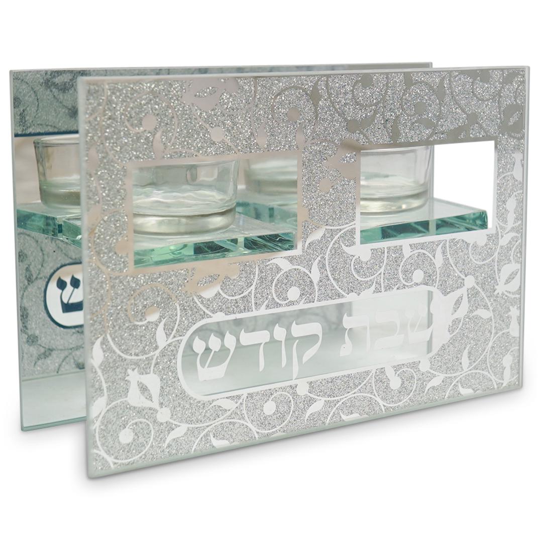 Judaica Mirror and Glass Candle Holder: DESCRIPTION: Judaica Candle Holder Mirror and Glass Stand with engraved foliage decoration and hebrew writing. CIRCA: 21st CenturyORIGIN: USADIMENSIONS: H: 4 7/8" W: 7" D: 2 1/2 "CONDITION: Great cond