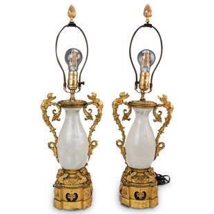 French Empire Gilt Bronze and Rock Crystal Lamps: DESCRIPTION: A Pair of French Empire gilt Bronze lamps positioned a the center with baluster form Rock Crystal, flanked on either side with detailed ornate berry motifs and mythological figural