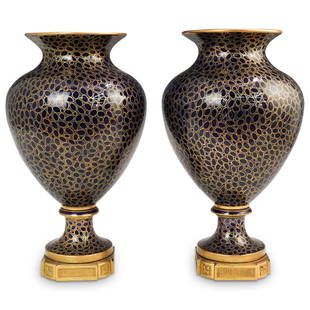 Pair Of Sevres Porcelain and Bronze Vases: DESCRIPTION: A Pair of Sevres porcelain vases featuring in a cobalt blue ground color, embellished with ovoid and circular gilt patterns, affixed to bronze bases. CIRCA: 19th to early 20th Cent.