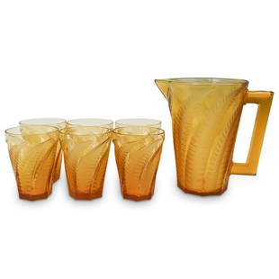 (6 Pc) R. Lalique "Hesperides" Pitcher and Glasses: DESCRIPTION: Rene Lalique lemonade set in the "Hesperides" pattern, circa 1930s, including a pitcher and six glasses, marked "Rene Lalique France". CIRCA: 1930s ORIGIN: France DIMENSIONS: Glass: 5 x