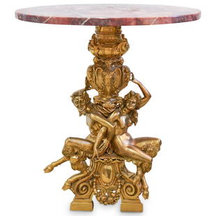 19th Cent. Antonio Pandiani Bronze and Marble Table: DESCRIPTION: A 19th Century table composed of a figural gilt bronze base depicting a Satyr and Satyress sitting along the stem, further accented by floral vine banners and baroque patterns. The base