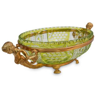 Gilt Bronze & Cut Crystal Centerpiece Bowl: DESCRIPTION: A French gilt bronze and crystal cut centerpiece bowl. Features a yellowish green toned crystal cut bowl with double gilt figural handles and animal paw footed base. CIRCA: 20th Cent.