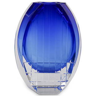 Baccarat Crystal "Neptune" Flower Vase: DESCRIPTION: A Baccarat Crystal vase features in a cobalt blue ground color, embellished with vertical and horizontal. Etched along the bottom with Baccarat seal. CIRCA: 20th Cent. ORIGIN: France