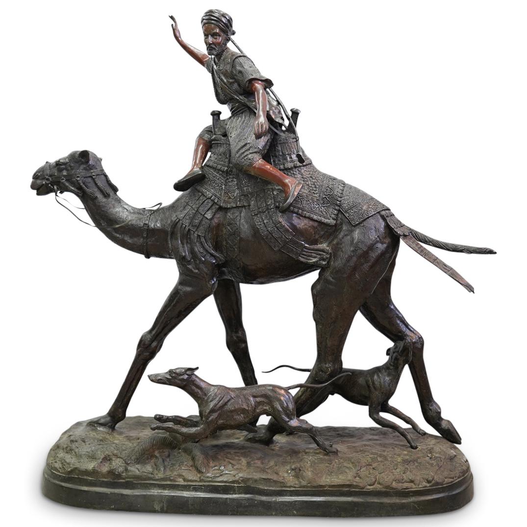 Pierre Jules Mene (French, 1810-1879) Monumental Bronze: DESCRIPTION: Pierre Jules Mene monumental bronze statue. Features a hunting scene with an orientalist figure on camelback surrounded by multiple working dogs. Signed "J. Mene" at base. CIRCA: 20th Cen