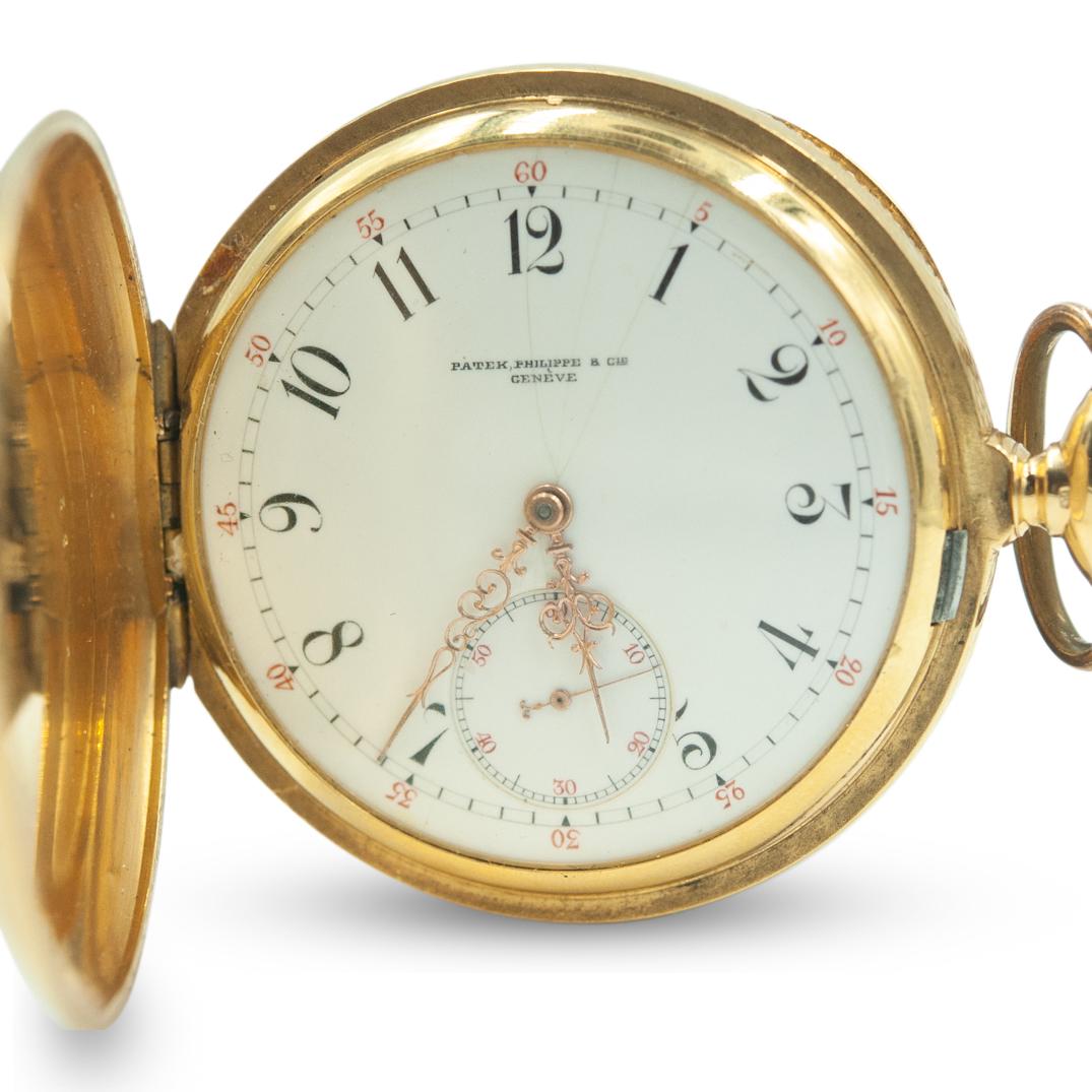 Antique Patek Philippe Gold Pocket Watch: DESCRIPTION: An antique Patek Philippe features an 18k gold hunter cased keyless lever. Finished with a nickel 20-jewel movement signed EXTRA, counterpoised escapement with Guillaume balance, blued ha