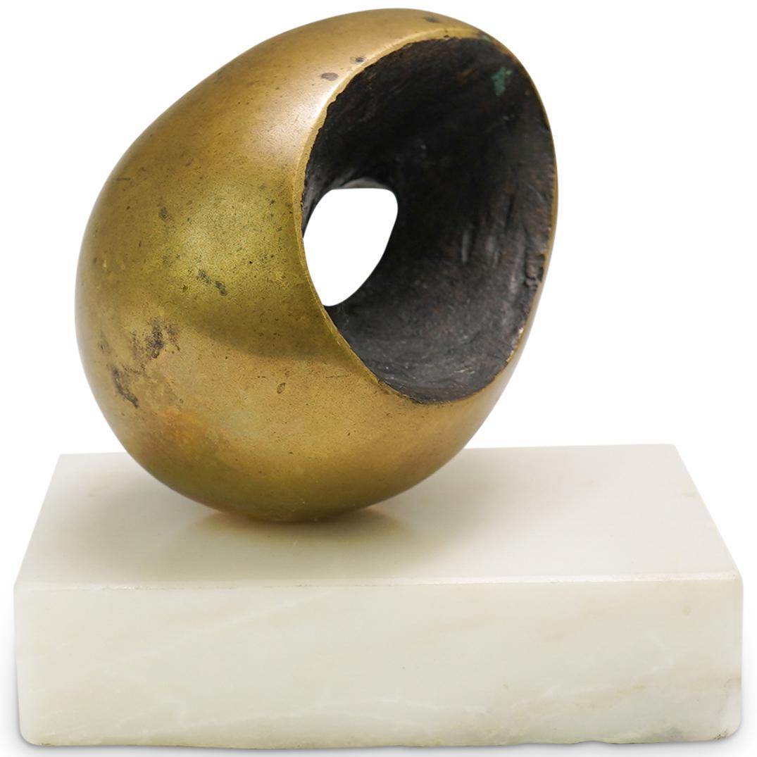 After Barbara Hepworth Modernist Bronze Sculpture: DESCRIPTION: A Modernist Bronze sculpture features in an ovoid form with a hollowed interior, fitted atop a marble base. CIRCA: 20th Cent. ORIGIN: Unknown DIMENSIONS: H: 5.5" W: 5" CONDITION: Great co