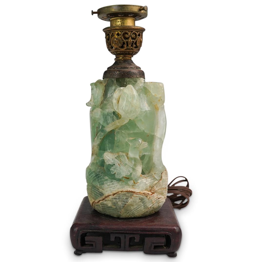 Antique Chinese Carved Quartz Lamp: DESCRIPTION: An antique Chinese carved green quartz crystal lamp with duck and lotus designs. Mounted to a wood carved base and fitted with single bulb socket out. CIRCA: Mid 19th - Early 20th Cent. O