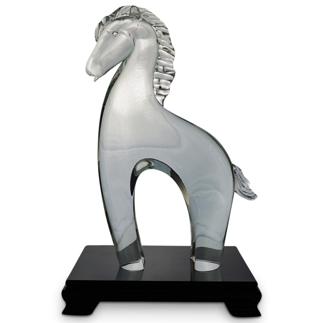 Murano Art Glass Horse Sculpture: DESCRIPTION: Murano Art Glass Horse Sculpture on a four legged wooden base. CIRCA: Mid. 20th Century. ORIGIN: Italy. DIMENSIONS: Horse H: 13 1/2" W: 8 1/2" . Base is D: 6 3/" L: 9 1/2". CONDITION: Goo