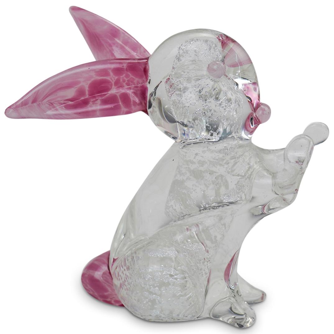 Murano "Rabbit" Glass Sculpture: DESCRIPTION: Murano "Rabbit" Hand Blown Art Glass Sculpture in clear glass with silver internal sparkles, and pink glass tail, ears, lips and eyes. CIRCA: 20th Century. ORIGIN: Italy. DIMENSIONS: H: 4