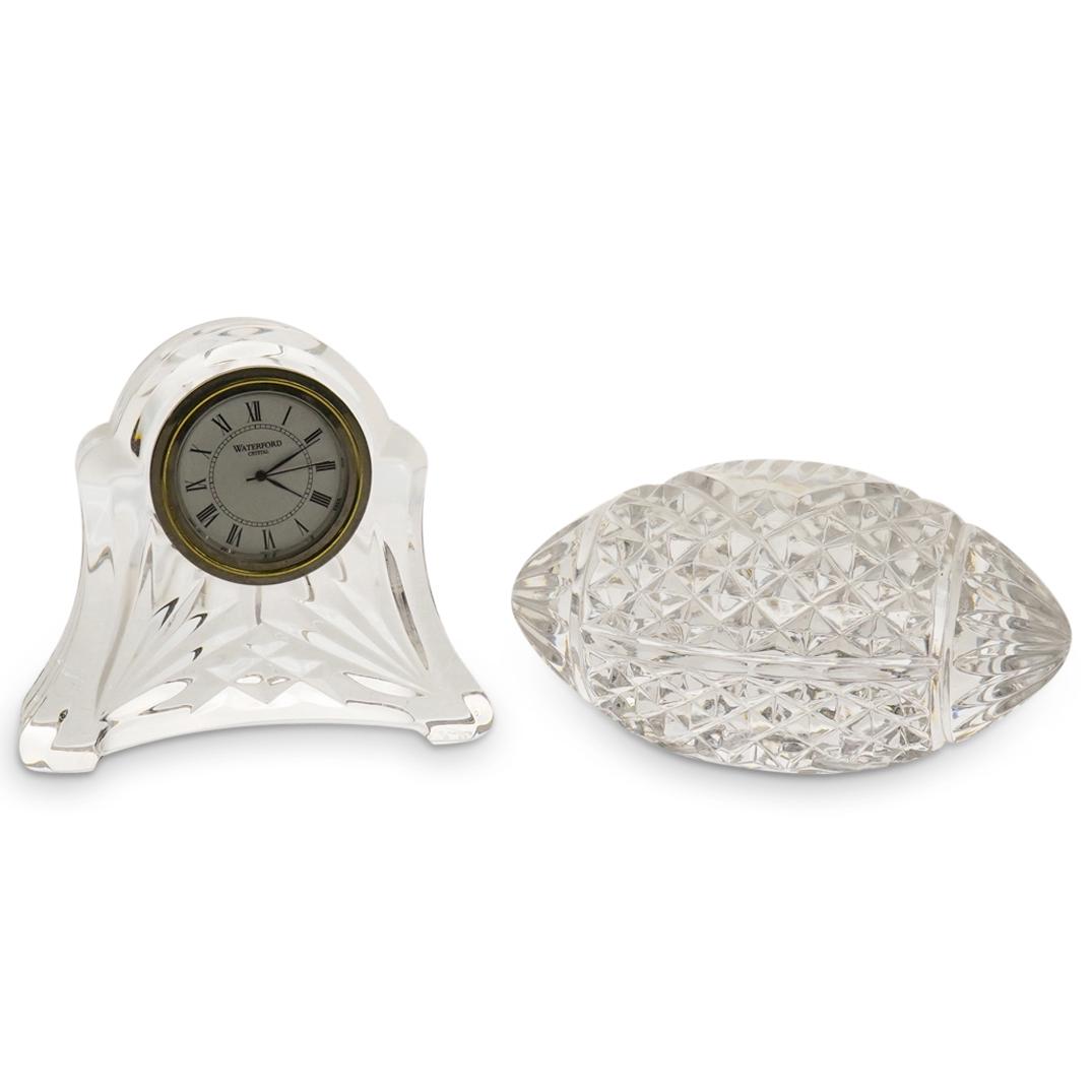 (2Pc) Waterford Crystal Grouping: DESCRIPTION: (2Pc) A Waterford crystal collection featuring a crystal desk clock and crystal cut football. Marked "Waterford" CIRCA: 20th Cent. ORIGIN: Waterford DIMENSIONS: (Clock) H: 3.5" x D: 4" (F
