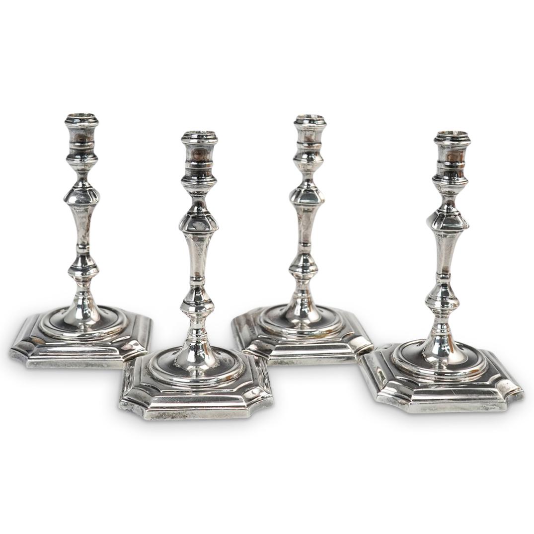 (4 Pc) Sterling Silver James Robinson Candlesticks Set: DESCRIPTION: (4 Pc) Set of Four Queen Anne Period Britannia Sterling Silver James Robinson candlesticks. In 1912, James Robinson founded the firm bearing his name at 402 Madison Avenue in New York Cit
