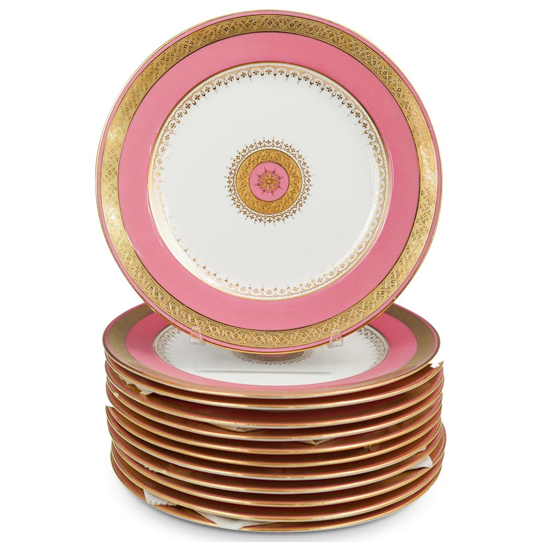 (12 Pc) Tiffany and Co. Mintons Porcelain Plates: DESCRIPTION: A set of 12 porcelain plates by Tiffany and co. and Mintons, decorated with a pink border and accented with ornate gilt trims. Marked Along the back with makers mark. CIRCA: 20th Cent. OR