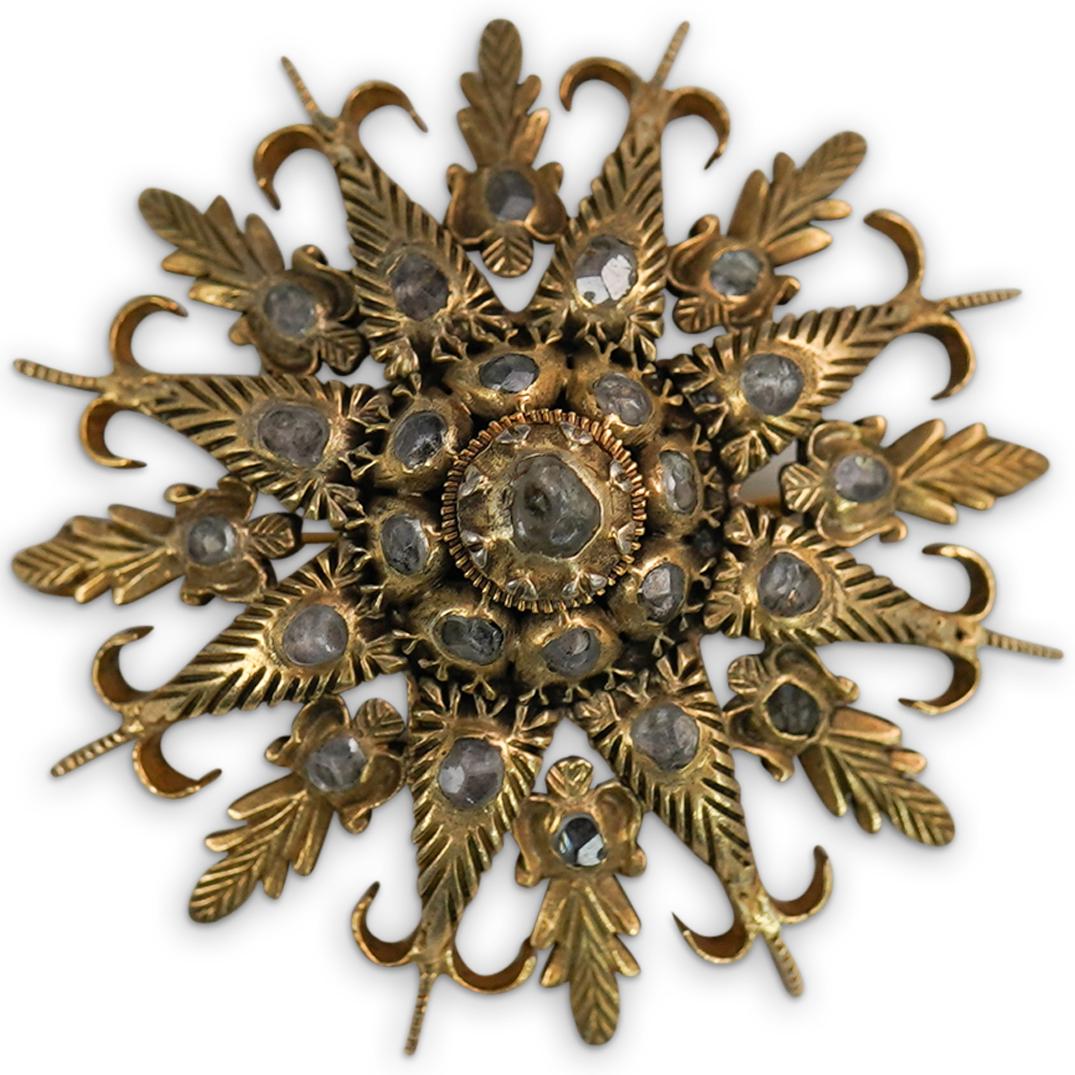 Antique Georgian Gilt Silver Starburst Brooch: DESCRIPTION: An antique Georgian gilt silver starburst brooch. CIRCA: 19th Cent. ORIGIN: USA DIMENSIONS: D: 1.75" Total Weight: 14.6 Grams CONDITION: Great condition. See lot description for details o