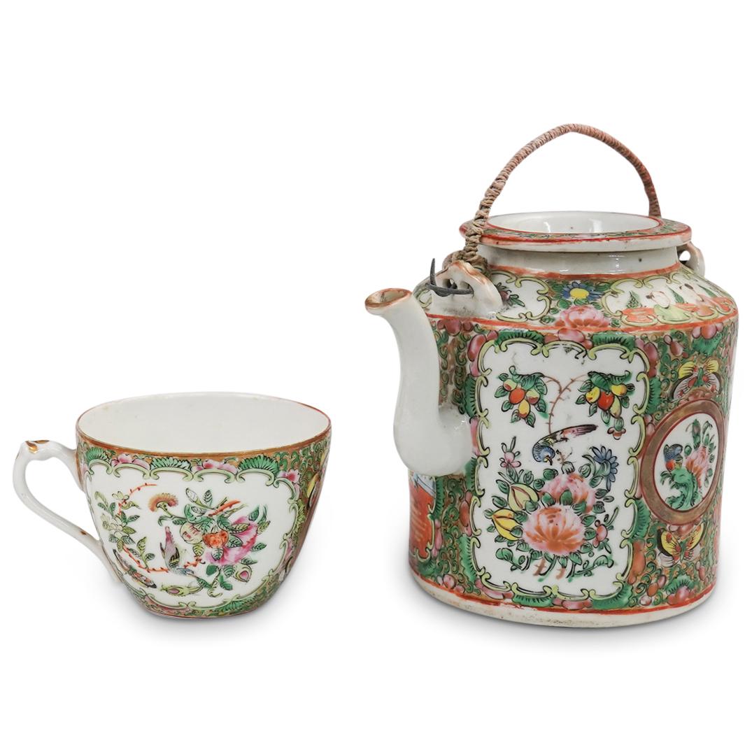 (2Pc) Chinese Rose Medallion Tea Set: DESCRIPTION: (2Pc) A Chinese rose medallion tea set. Features a porcelain lidded tea pot and tea cup with figural interior scenes throughout. Includes a woven cane carrying case with floral lined inte