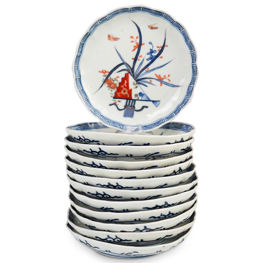 (12 Pc) Japanese Imari Porcelain Plates: DESCRIPTION: (12 Pc) Japanese Imari porcelain plates set. Decorated by hand with a fan motif in an underglaze blue and overpainted in iron red, aqua and gold. Marked along the underside. CIRCA: 20th C