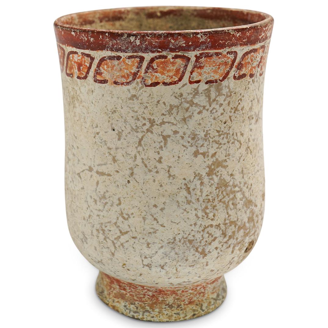 Pre Columbian Earthenware Vase: DESCRIPTION: A Pre Columbian Earthenware vase decorated with a white painted overlay and etched with decorated with geometric shapes along the upper rim. CIRCA: Pre columbian ORIGIN: Central or South 