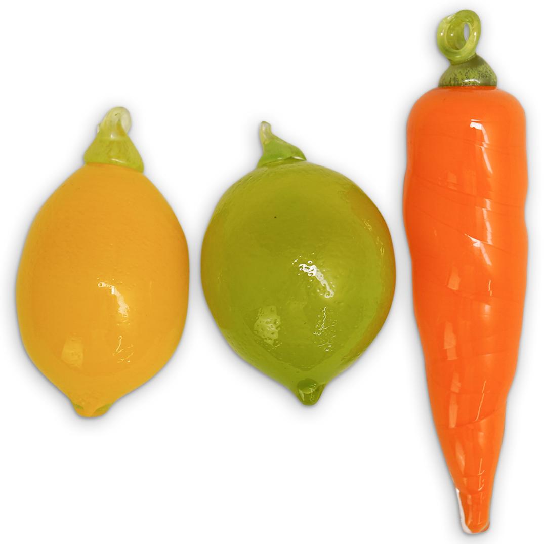 (3 Pc) Murano Glass Fruits / Veggie: DESCRIPTION: (3 Pc) Murano Glass Fruits and Veggie Set. Realistic life size art glass sculptures of lemon, lime and carrot grouping. CIRCA: 20th Century. ORIGIN: Italy. DIMENSIONS: Lemon and lime are 